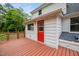 Close up of the deck with a red door with a window, and lattice railing at 5601 Buffaloe Rd, Raleigh, NC 27616