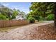 View of the home and wooden fence from the street, showcasing the property's curb appeal at 5601 Buffaloe Rd, Raleigh, NC 27616