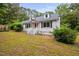 Attractive house featuring a bright red door, white trim and tidy front yard at 5601 Buffaloe Rd, Raleigh, NC 27616