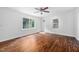 Well-lit living room with hardwood floors, front door, and neutral decor at 5601 Buffaloe Rd, Raleigh, NC 27616