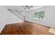 Bright living room with hardwood floors, staircase, and plenty of natural light at 5601 Buffaloe Rd, Raleigh, NC 27616