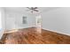 Open living room with gleaming hardwood floors and a welcoming front entrance at 5601 Buffaloe Rd, Raleigh, NC 27616