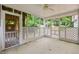 Screened-in porch with ceiling fan, perfect for enjoying the outdoors in comfort at 5601 Buffaloe Rd, Raleigh, NC 27616