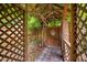 Wood gazebo-like structure surrounded by verdant landscaping creating a secluded outdoor retreat at 5601 Buffaloe Rd, Raleigh, NC 27616