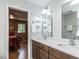 Bathroom with double sink vanity, a glass shower stall, and view to a bedroom at 5809 Kimbal St, Raleigh, NC 27606