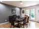 Dining room with hardwood floors, modern furniture, and a view of the outdoors at 5809 Kimbal St, Raleigh, NC 27606