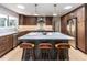 Stylish kitchen with a center island, modern appliances, and hardwood floors at 5809 Kimbal St, Raleigh, NC 27606
