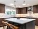 Contemporary kitchen with island, pendant lighting, and stainless steel appliances at 5809 Kimbal St, Raleigh, NC 27606