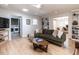 Relaxing living area with a view into the laundry room, and a comfortable seating arrangement at 5809 Kimbal St, Raleigh, NC 27606