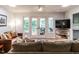 The cozy living room features plush seating, natural lighting, and a view of the deck at 5809 Kimbal St, Raleigh, NC 27606
