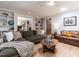 Comfortable living area showcasing built-in shelving, stylish furnishings, and hardwood floors at 5809 Kimbal St, Raleigh, NC 27606