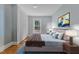 Bedroom featuring hardwood floors, a comfortable bed, and a modern design at 602 Dunbar St, Durham, NC 27701