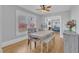 Cozy dining room with natural light, hardwood floors, and comfortable seating at 602 Dunbar St, Durham, NC 27701