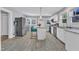 Bright and airy kitchen featuring white cabinets, stainless steel appliances, and a center island at 602 Dunbar St, Durham, NC 27701