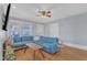 Bright living room features hardwood floors, a comfortable blue sectional sofa, and ample natural light at 602 Dunbar St, Durham, NC 27701