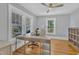 Bright home office featuring large windows, hardwood floors, and a ceiling fan at 602 Dunbar St, Durham, NC 27701