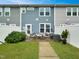 Private back patio with stylish seating, fenced yard, and lush landscaping at 6536 Perry Creek Rd, Raleigh, NC 27616