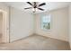 Bedroom featuring a ceiling fan, neutral carpet and a window with blinds at 6536 Perry Creek Rd, Raleigh, NC 27616