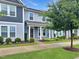 Attractive townhome showcases two-story architecture, manicured lawns, and mature trees at 6536 Perry Creek Rd, Raleigh, NC 27616