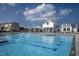 Resort-style community pool and clubhouse, with lounge chairs and clear blue water at 6536 Perry Creek Rd, Raleigh, NC 27616