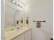 Bathroom featuring a single sink vanity, a large mirror, and neutral color scheme at 72 Justin Ct, Durham, NC 27705