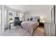 Bright bedroom featuring soft carpet, a large window with light curtains, and calming neutral paint at 72 Justin Ct, Durham, NC 27705
