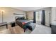 Bedroom with neutral carpet, a window with curtains, and dark furniture at 72 Justin Ct, Durham, NC 27705