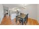 Dining area adjacent to the kitchen with wood floors and modern lighting at 72 Justin Ct, Durham, NC 27705