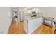 Bright kitchen with stainless steel appliances, white cabinetry, and light countertops at 72 Justin Ct, Durham, NC 27705
