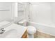 All-white bathroom featuring shower-tub combo with tiled flooring, vanity with storage and white toilet at 735 Sycamore Springs Dr, Fuquay Varina, NC 27526