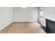 Spacious living room with neutral walls, fireplace, and large window for natural light at 735 Sycamore Springs Dr, Fuquay Varina, NC 27526