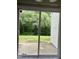 View of tree-lined backyard from sliding glass door at 7832 Averette Field Dr, Raleigh, NC 27616