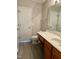 Bathroom featuring a double sink vanity with wood cabinets and a large mirror at 7832 Averette Field Dr, Raleigh, NC 27616