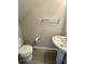 Small half bathroom with a sink and toilet at 7832 Averette Field Dr, Raleigh, NC 27616
