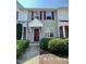 Charming townhouse featuring a stylish front door with a covered entryway and well-maintained landscaping at 7832 Averette Field Dr, Raleigh, NC 27616
