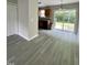 Open kitchen and dining area with sliding glass doors, featuring modern flooring and ample natural light at 7832 Averette Field Dr, Raleigh, NC 27616