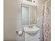 Bathroom with white vanity, mirror, and patterned shower curtain adding style at 784 Crawford Rd, Coats, NC 27521