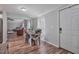 Cozy dining area with seating for four, wood floors, and views of the living room at 784 Crawford Rd, Coats, NC 27521