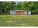 Exterior view of a backyard with a storage building at 784 Crawford Rd, Coats, NC 27521