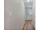 This is a hallway with hardwood floors, neutral paint and white door frames at 784 Crawford Rd, Coats, NC 27521