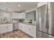 This is a beautifully designed kitchen with stainless steel appliances and custom tile backsplash at 784 Crawford Rd, Coats, NC 27521