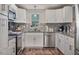 This is a well-lit kitchen featuring granite countertops and stainless steel appliances at 784 Crawford Rd, Coats, NC 27521