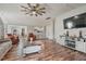 This is a spacious living room with hardwood floors and a decorative ceiling fan at 784 Crawford Rd, Coats, NC 27521
