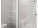 Bathroom with a tiled shower and tub and wire shelves for storage at 807 S Mebane St., Burlington, NC 27215