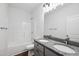 Bright bathroom featuring a double vanity with granite countertop and modern fixtures, plus shower and tub at 807 S Mebane St., Burlington, NC 27215