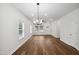 Open living space featuring hardwood floors, ceiling fan, kitchen, and dining area at 807 S Mebane St., Burlington, NC 27215
