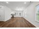 Open-concept living space featuring hardwood floors, recessed lighting, and a seamless flow to the adjacent kitchen at 807 S Mebane St., Burlington, NC 27215