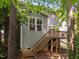 Backyard view of exterior, showing steps leading to wooden deck and backyard at 904 Pirouette Ct, Raleigh, NC 27606