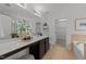 Bright bathroom featuring a dual vanity, a tub, and a walk-in closet at 904 Pirouette Ct, Raleigh, NC 27606
