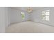 Spacious bedroom with carpeted floors, recessed lighting, and two windows at 904 Pirouette Ct, Raleigh, NC 27606